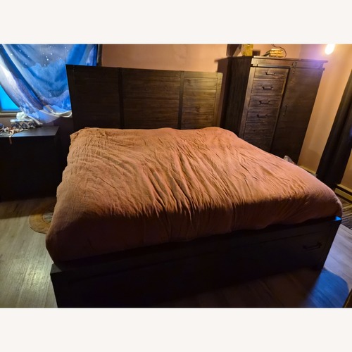 Used Raymour & Flanigan Dark Brown Wood King Bed for sale on AptDeco