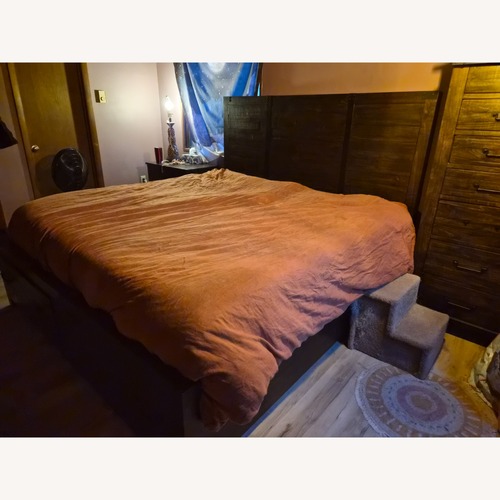 Used Raymour & Flanigan Dark Brown Wood King Bed for sale on AptDeco