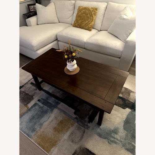Used Jordan's Furniture Dark Brown Wood Coffee Table for sale on AptDeco