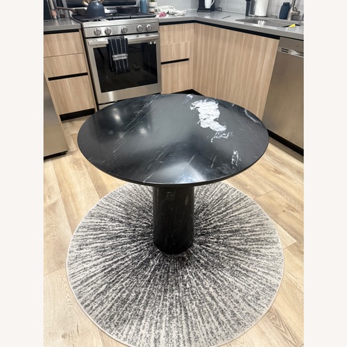 Used CB2 Black Marble Dining Table for sale on AptDeco
