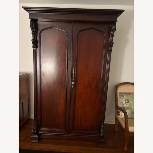 Used British Colonial Carved Rosewood Antique Armoire for sale on AptDeco