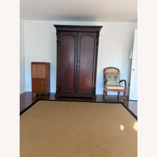 Used British Colonial Carved Rosewood Antique Armoire for sale on AptDeco