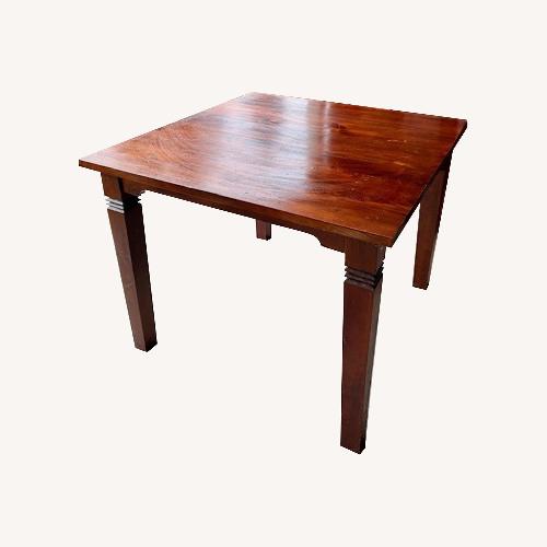 Used Indonesian Teak Dark Brown Wood Dining Table for sale on AptDeco