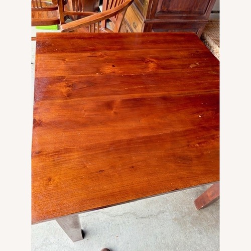 Used Indonesian Teak Dark Brown Wood Dining Table for sale on AptDeco