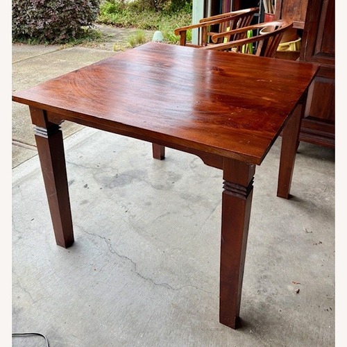 Used Indonesian Teak Dark Brown Wood Dining Table for sale on AptDeco