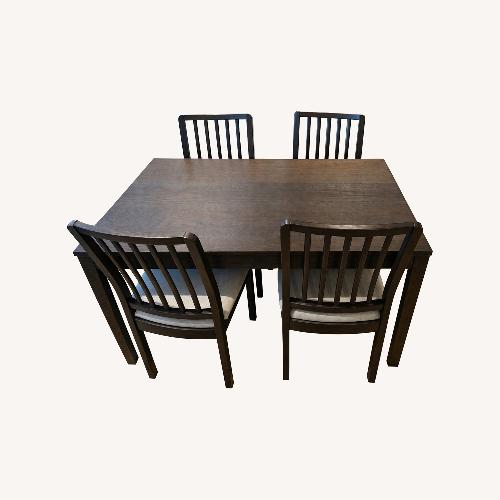 Used IKEA Dark Brown Wood Dining Set with 4 Chairs for sale on AptDeco
