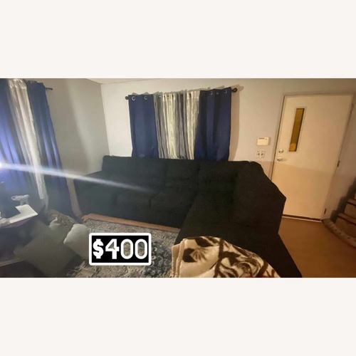 Used Ashley Furniture Black 2 Piece Sectional for sale on AptDeco