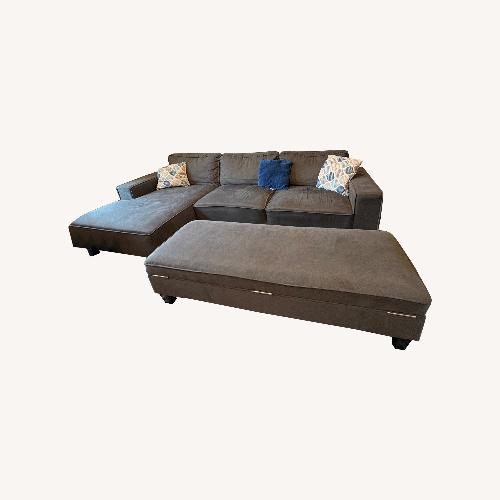 Used Dark Gray Sectional Sofa with Ottoman & Cushions  for sale on AptDeco