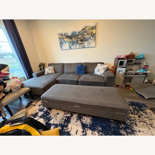 Used Dark Gray Sectional Sofa with Ottoman & Cushions for sale on AptDeco