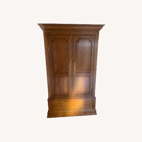 Used Ethan Allen Natural Wood Armoire for sale on AptDeco