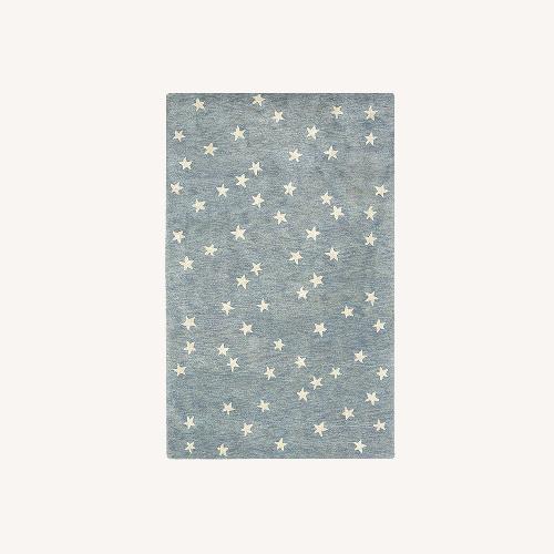 Used Pottery Barn Blue Starry Wool Rug and Pad 5' x 8' for sale on AptDeco