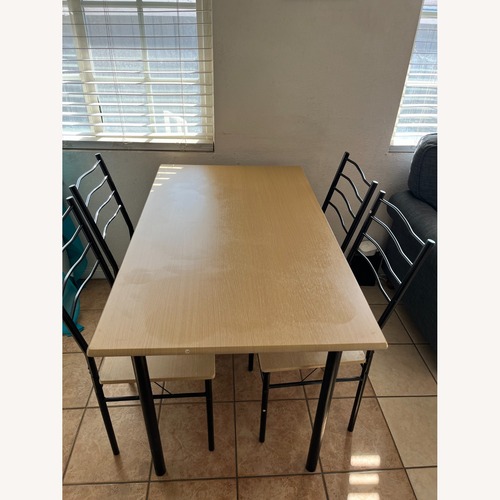 Used Light Brown Dining Table for sale on AptDeco