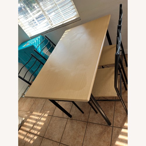 Used Light Brown Dining Table for sale on AptDeco