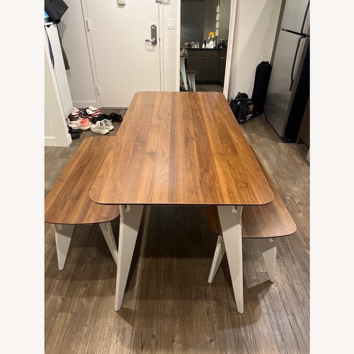 Used Hoek Home Dark Brown Wood Dining Table for sale on AptDeco