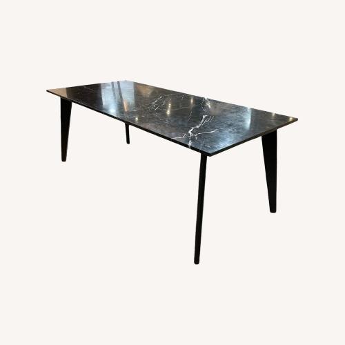 Used CB2 Harper Black Marble Slab Top Dining Table for sale on AptDeco