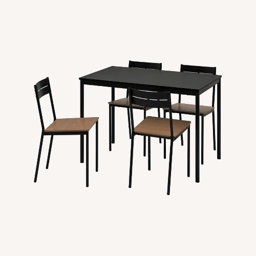 Used IKEA Sandsberg Black Table and 4 Sandsberg Chairs for sale on AptDeco