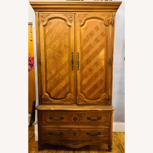 Used Vintage/Antique Natural Wood Armoire for sale on AptDeco