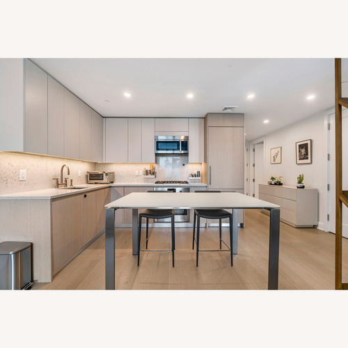 Used Room & Board White Glass Dining Table for sale on AptDeco