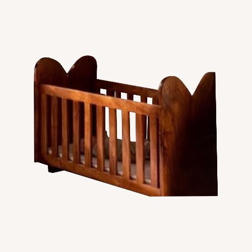 Used Vintage/Antique Dark Brown Wood Crib for sale on AptDeco