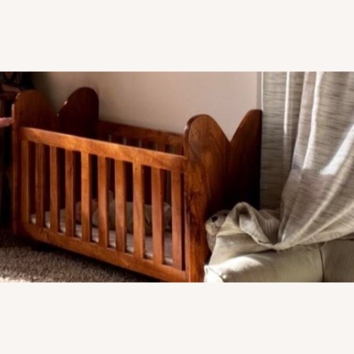 Used Vintage/Antique Dark Brown Wood Crib for sale on AptDeco