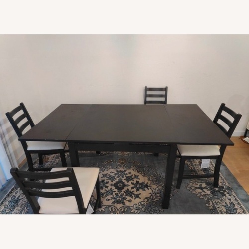 Used Black Metal Dining Table for sale on AptDeco