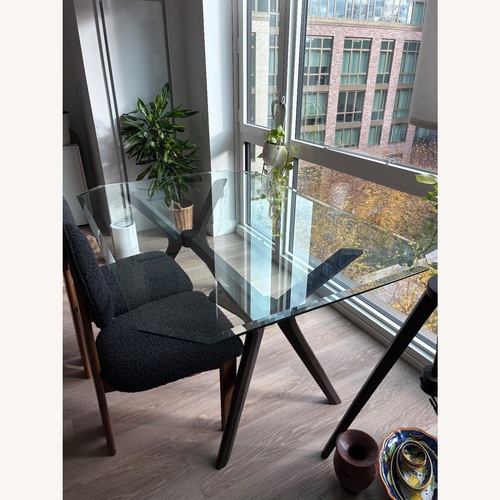 Used Modern Glass Dining Table Solid Wood Base for sale on AptDeco