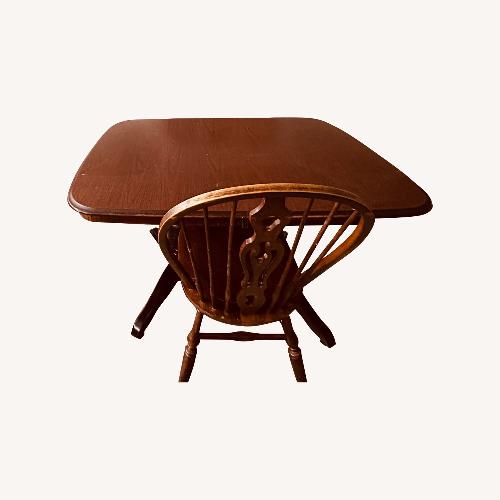 Used Dark Brown Wood Dining Table for sale on AptDeco