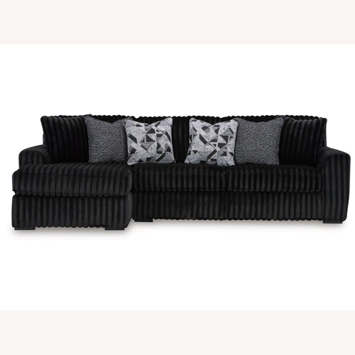 Used Ashley Furniture Black 2 Piece Sectional for sale on AptDeco