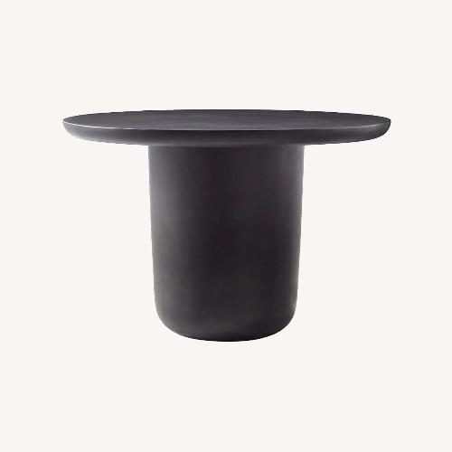 Used CB2 Lola 45" Round Black Concrete Dining Table for sale on AptDeco