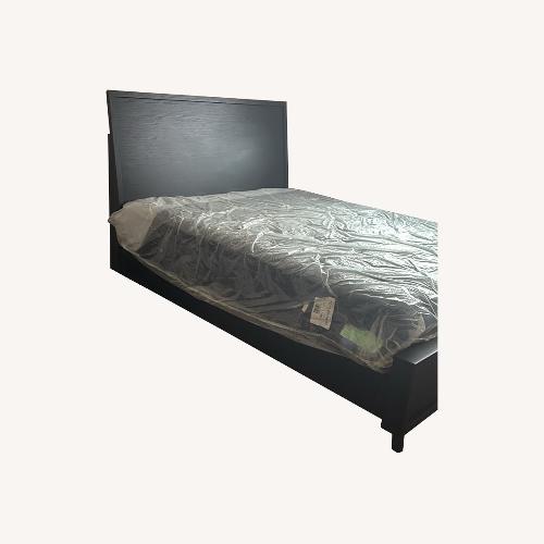 Used Black Wood Queen Bed for sale on AptDeco