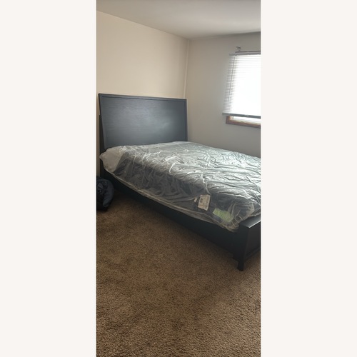 Used Black Wood Queen Bed for sale on AptDeco