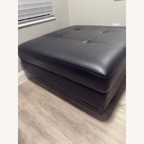 Used Black Leather Ottoman for sale on AptDeco