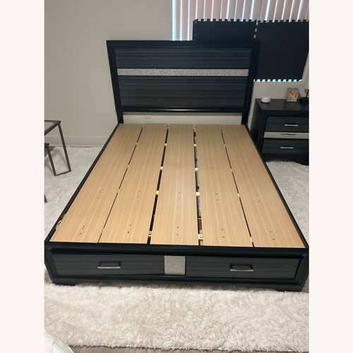Used Black Wood Queen Bed for sale on AptDeco