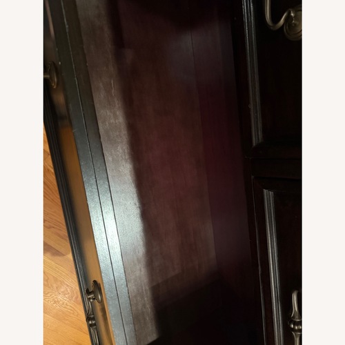 Used Ashley Classic Dark Wood Drawer Dresser for sale on AptDeco