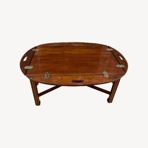 Used Dark Brown Wood Coffee Table with flip sides for sale on AptDeco