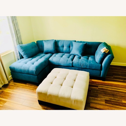 Used Rooms To Go Cindy Crawford Sectional & Ottoman for sale on AptDeco