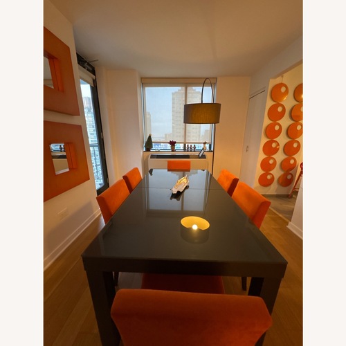 Used Ligne Roset Eureka Dining Table Set with Deco Items for sale on AptDeco