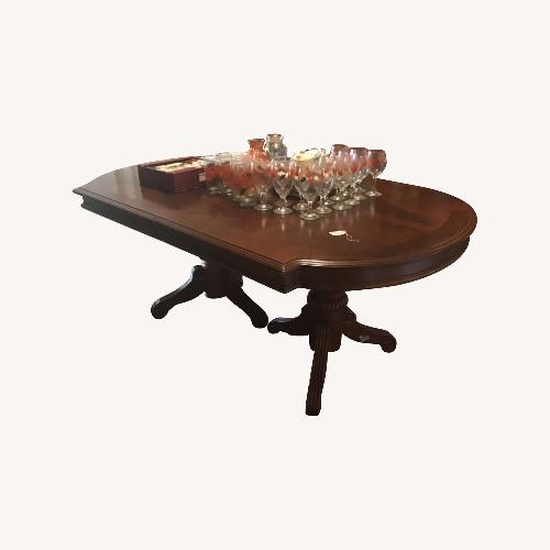 Used Dark Brown Wood Dining Table for sale on AptDeco