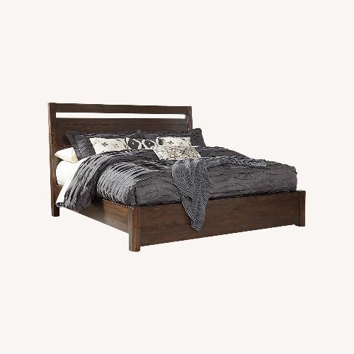 Used Ashley Starmore Dark Brown Wood Queen Bed for sale on AptDeco