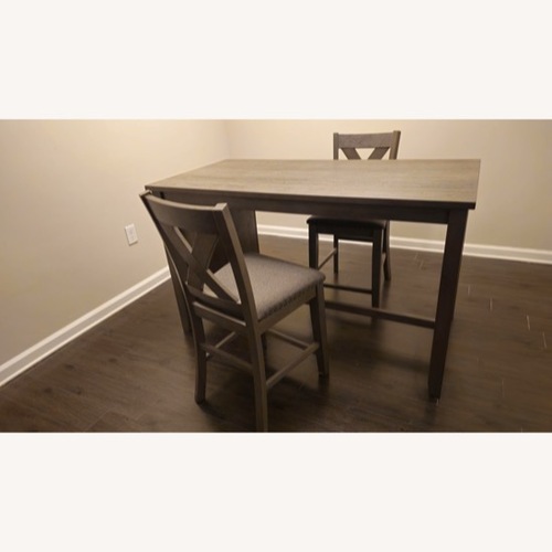 Used Ashley Caitbrook Brown Dining Set 2 Bar stools for sale on AptDeco