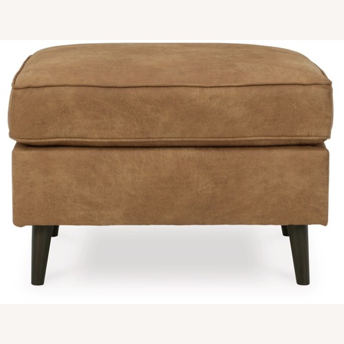 Used Ashley Maimz Caramel Faux Leather Ottoman for sale on AptDeco