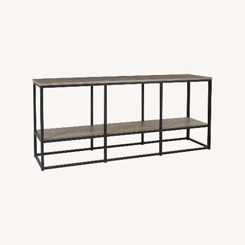 Used Ashley Wadeworth Light Brown 65" TV Stand for sale on AptDeco