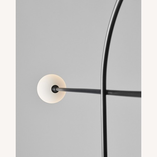 Used Bow Black Metal Floor Lamp for sale on AptDeco