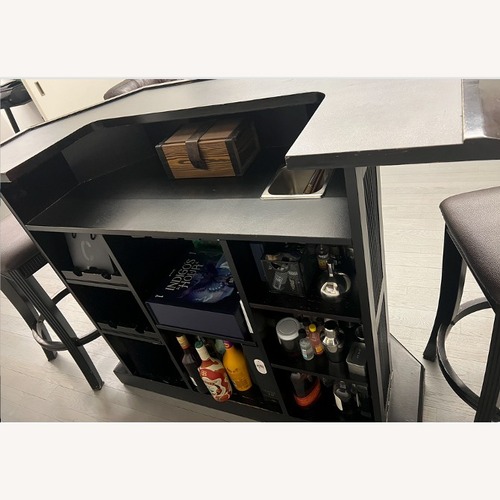 Used Real Wood Bar with Matching Stools for sale on AptDeco