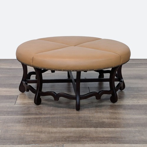 Used Round Leather Ottoman with Wood Base for sale on AptDeco
