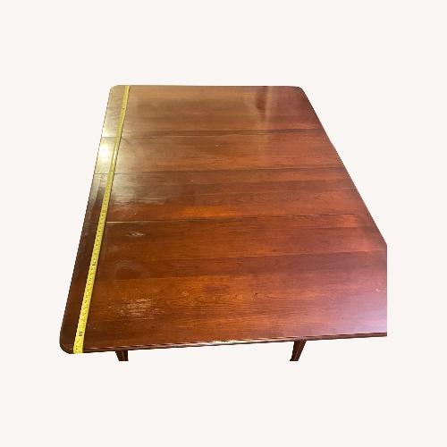 Used Dark Brown Dining Table for sale on AptDeco