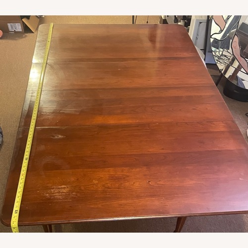 Used Dark Brown Dining Table for sale on AptDeco