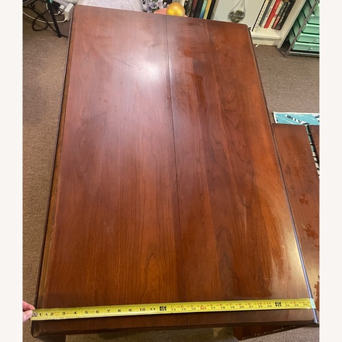 Used Dark Brown Dining Table for sale on AptDeco