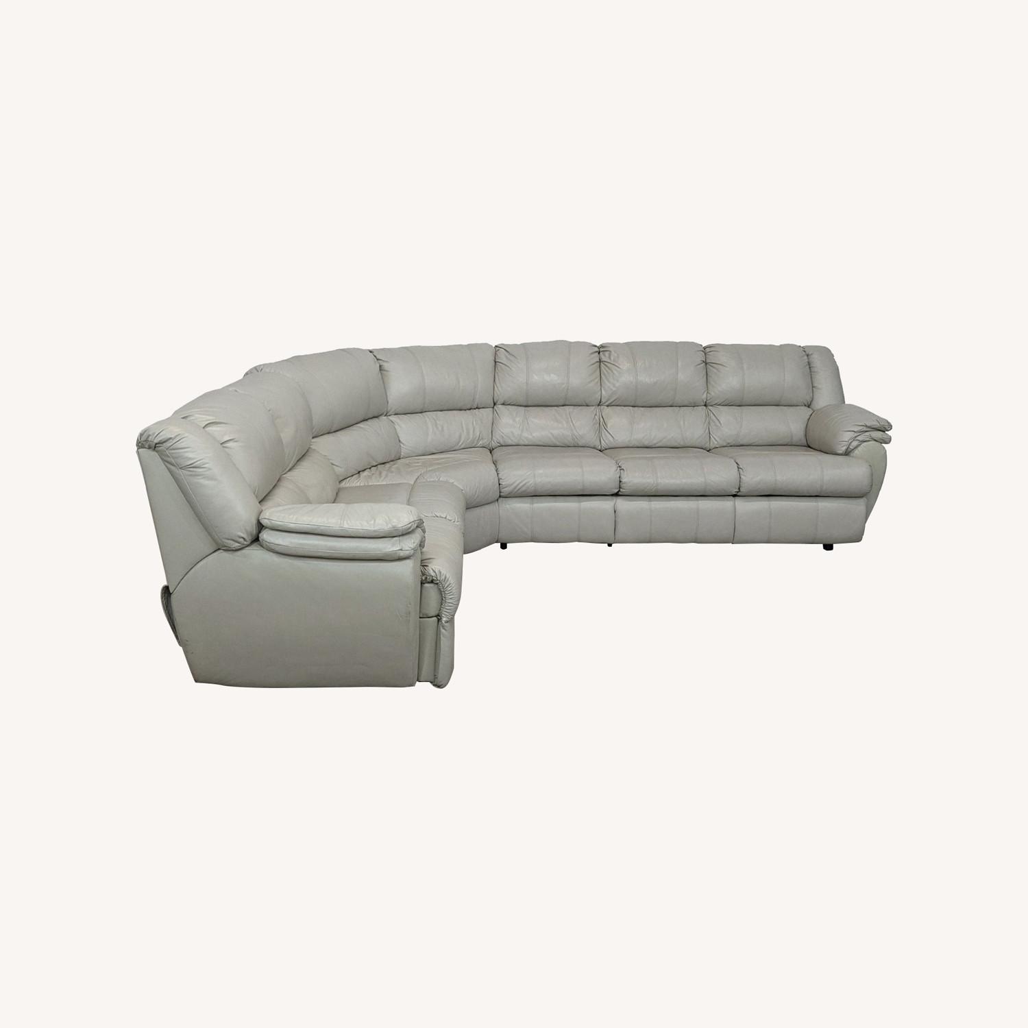 Ashley Leather Sectional with Recliner and Sleeper - image-0