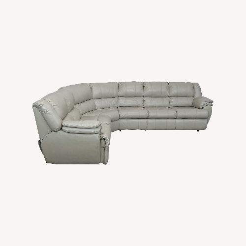 Used Ashley Leather Sectional with Recliner and Sleeper for sale on AptDeco